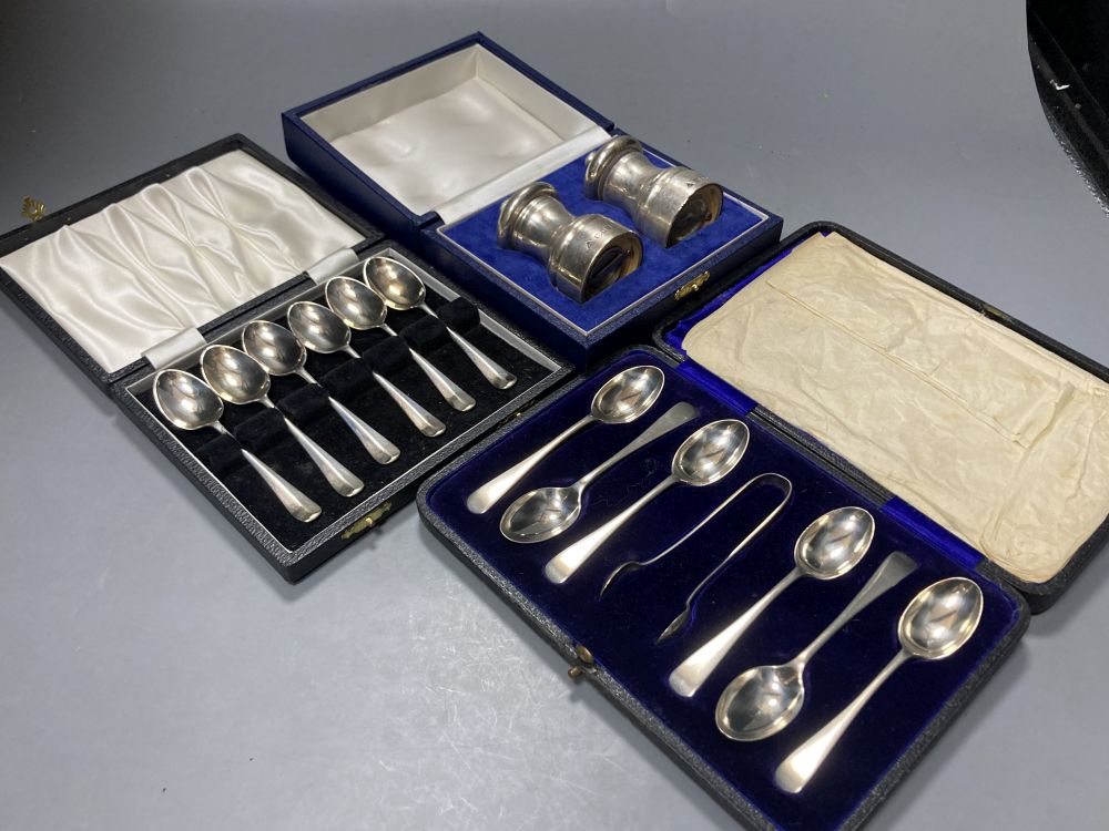 A cased pair of modern silver salt and pepper grinders, 74mm and two cased sets of six silver coffee spoons